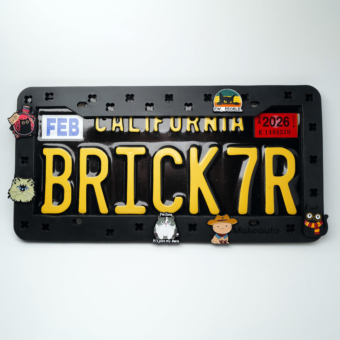 Funny cat-themed DIY license plate frame with customizable charms