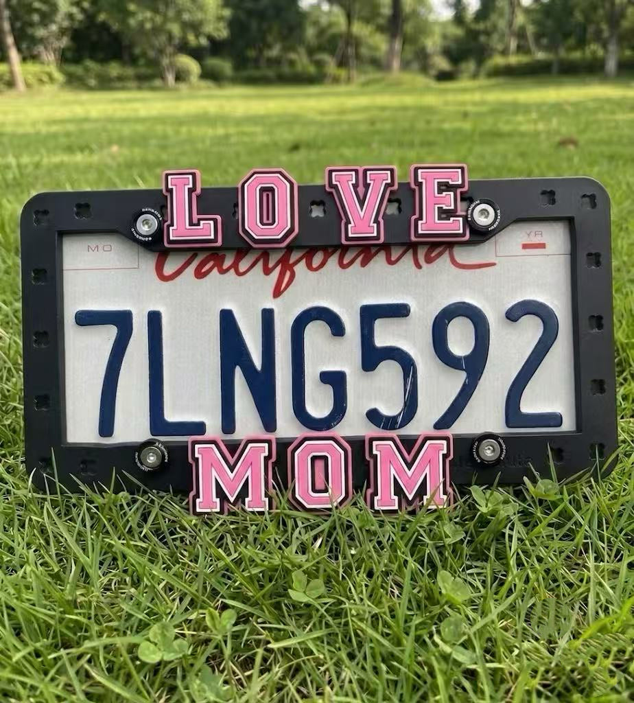 Makoauto clog-style license plate frame with 3D pink LOVE MOM shoe charms on a California plate