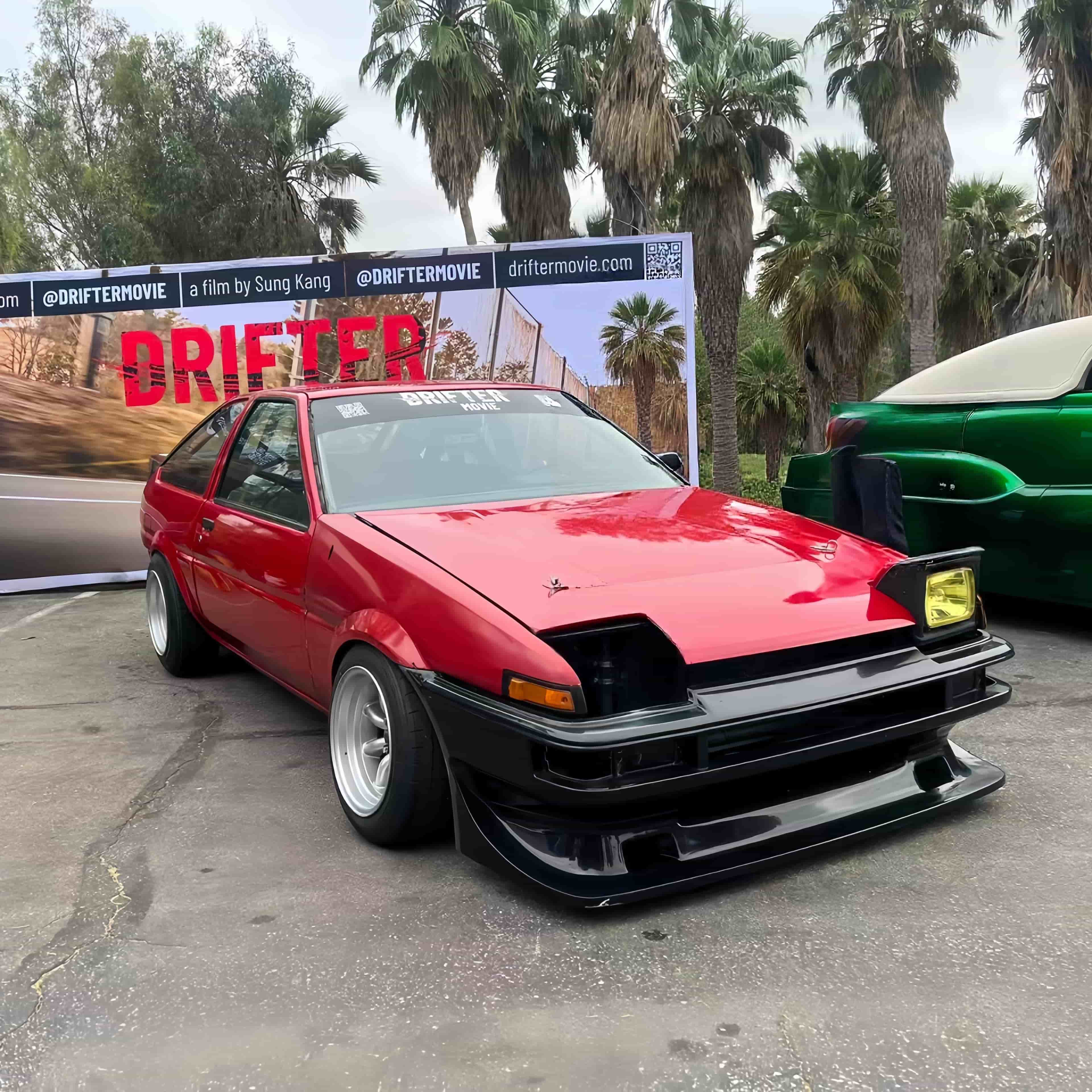 Iconic red AE86 custom drift car showcased at the Drifter movie promotional event by Sung Kang