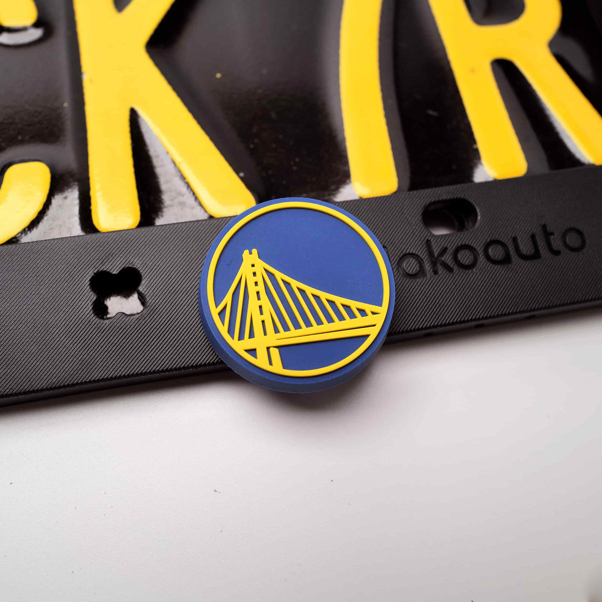 Macro shot showing a cool basketball sports theme accessory perfectly fitted onto the custom silicone-feel car tag bracket