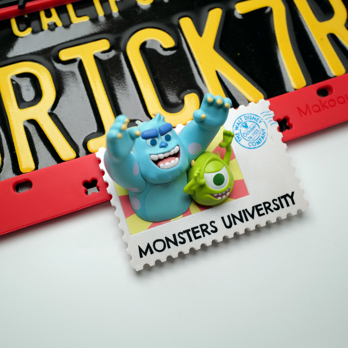 Close-up detail of the nostaligic "University Postage Stamp" style shoe charm with the classic cartoon duo and text.